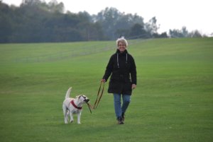 Smiling woman walking do | Arbor Ridge | Pet Friendly