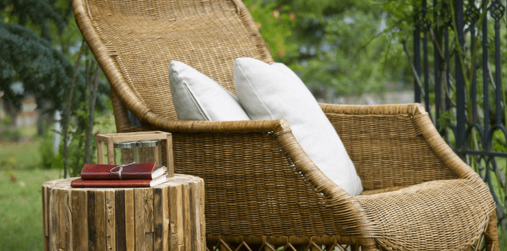 relaxing chair and reading material outdoors | Active Adult Lifestyle | DRA Homes